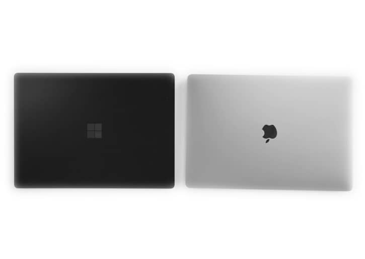 Microsoft Surface Pro 3 and a Macbook Pro side by side